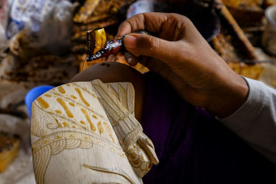 Close-up of woman holding hands