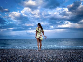 Full length of man on beach against sky