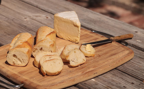 Close-up of bread with cheese on wooden table