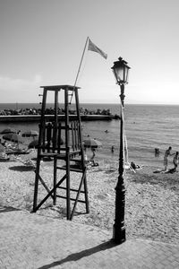 Lifeguard hut on beach against clear sky