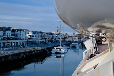 Boats moored at harbor