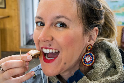 Portrait of woman eating food