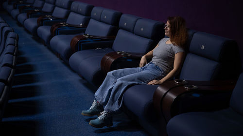 Woman sitting in theatre