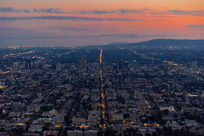 High angle view of city against sky during sunset