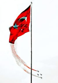 Low angle view of flag against sky