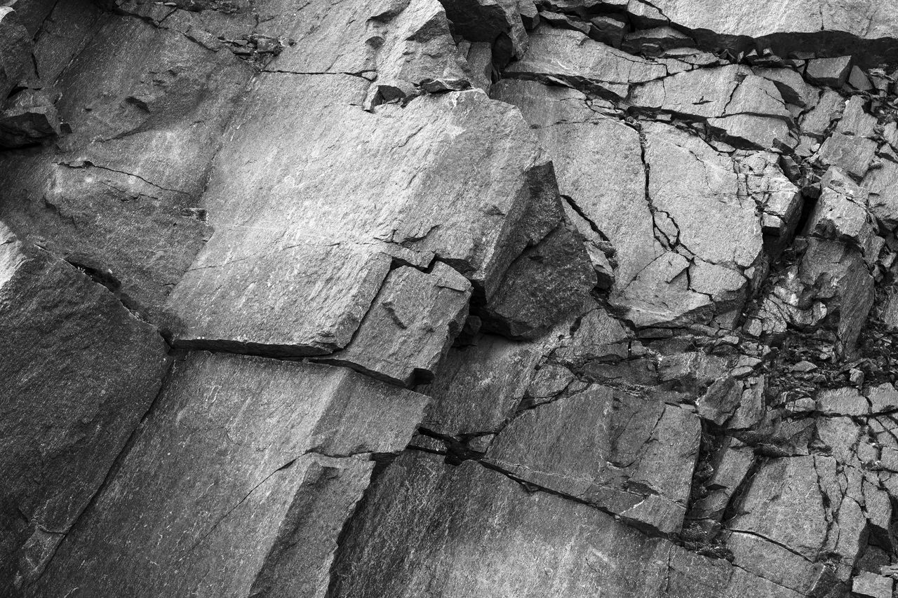 HIGH ANGLE VIEW OF CRACKED ROCKS