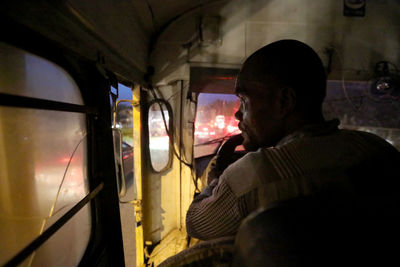 Man sitting in car