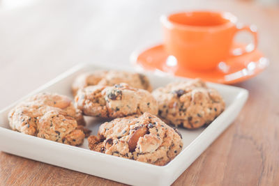 Close-up of cookies and coffee cup on table