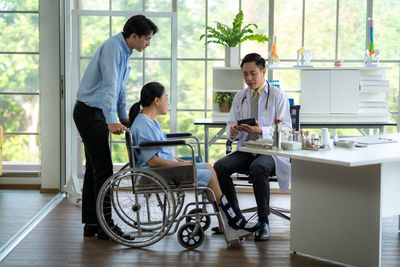 Side view of business colleagues working at office