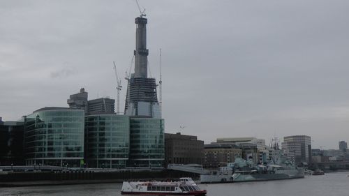 Modern buildings in city against sky