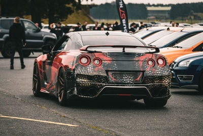 Close-up of car on road