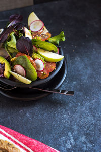 High angle view of fruits in plate on table