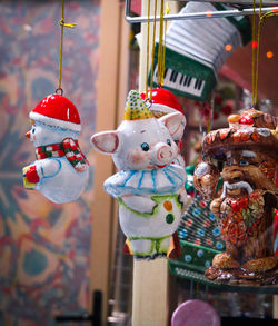 Close-up of toys hanging at market stall