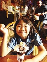 Portrait of young woman eating food