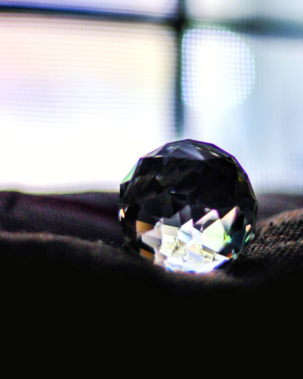 CLOSE-UP OF CRYSTAL BALL ON TABLE