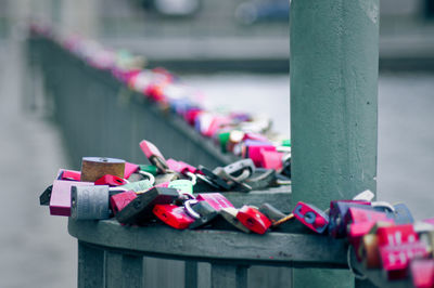 Close-up of padlocks hanging on railing