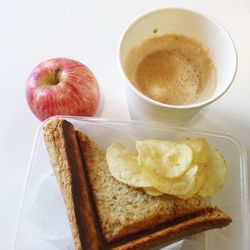 Close-up of sandwich and apple