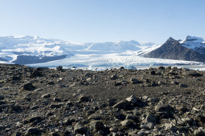 Scenic view of mountains against clear blue sky