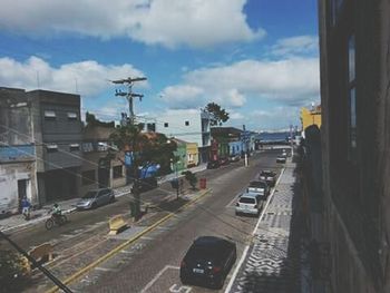 Cars on road against sky