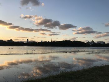 Scenic view of lake against sky during sunset