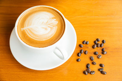 High angle view of coffee cup on table