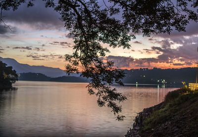 Scenic view of lake against sky during sunset