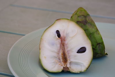 High angle view of fruit in plate on table