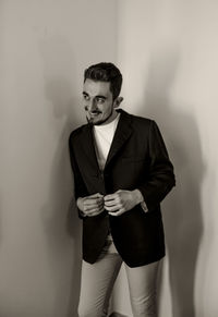 Full length of man standing against white background