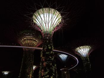 Illuminated ferris wheel at night