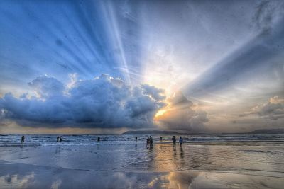 Scenic view of sea against sky at sunset