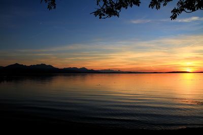 Scenic view of sea against romantic sky at sunset