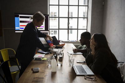 People working on table at home