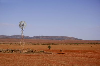 Scenic view of field against blue sky