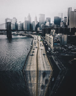 High angle view of river amidst buildings in city