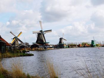 Traditional windmill against sky