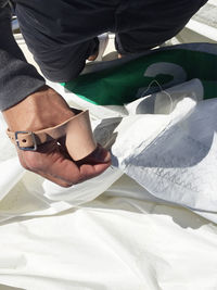 Low section of people on bed