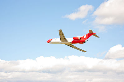 Low angle view of airplane flying in sky