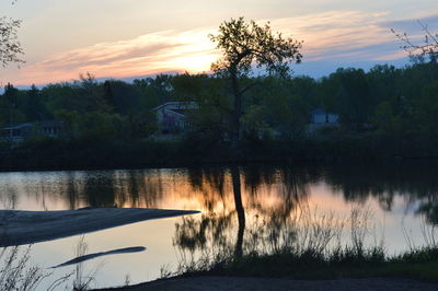 Scenic view of lake against sky during sunset