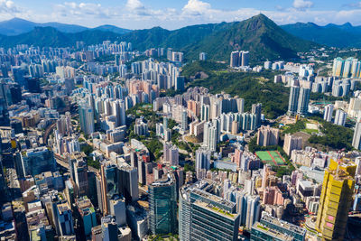 High angle view of buildings in city against sky