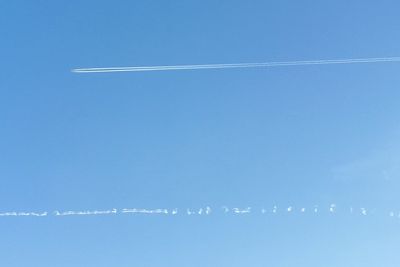 Aerial view of vapor trails in sky