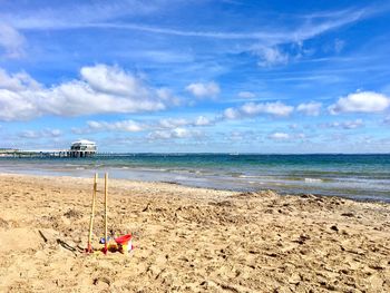 View of beach against cloudy sky