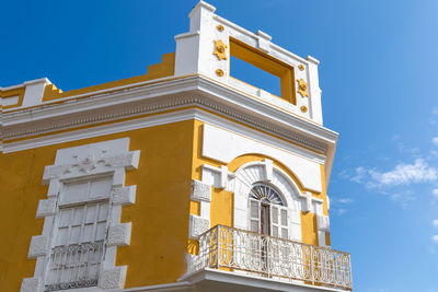 Low angle view of building against blue sky