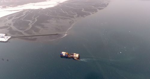 High angle view of nautical vessel on sea during winter