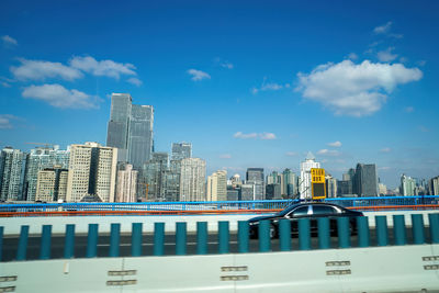 Modern buildings in city against sky