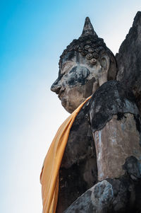 Low angle view of statue against sky