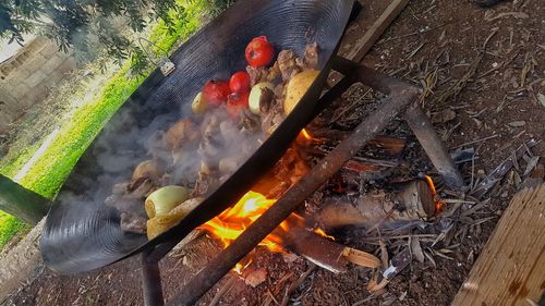 High angle view of meat on barbecue grill