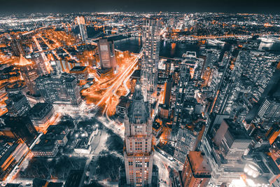 Aerial view of city lit up at night