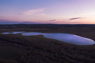 Scenic view of landscape against sky during sunset