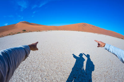 Shadow of people on sand