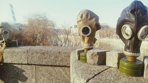 Close-up of coin-operated binoculars against sky